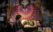 A woman receives a tattoo during the Paris Tattoo Convention (Mondial du Tatouage) on Marc...