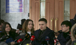 MP Nadia Savchenko talks to media representatives before the questioning at Security Servi...