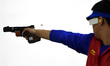 (140924) -- INCHEON, Sept. 24, 2014 () -- Zhang Jian of China aims during the 25m rapid fi...