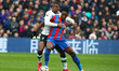 Crystal Palace's Wilfried Zaha tussles with Liverpool's Georginio Wijnaldumduring the Pre...