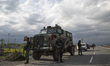 Indian army personnel stand in guard near the gunfight site Wednesday, April 11, 2018, in...