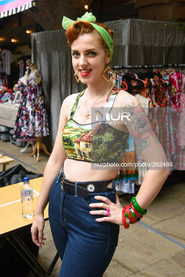 The 10th International London Tattoo Convention on 26/09/2014 at Tobacco Dock, London. Stall holders in 1950's style fashion. Picture by Jul...