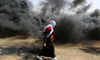 Palestinian protesters during a protest at the Gaza Strip's border with Israel, Friday, Ap...