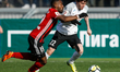 Reziuan Mirzov (R) of FC Tosno and Brian Idowu of FC Amkar Perm vie for the ball during th...