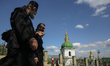 MOnks walks past the church at Kyiv Pechersk Lavra of Moscow Patriarchate in Kyiv, Ukraine...