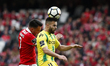 Tondela's forward Miguel Cardoso (R) heads for the ball with Benfica's midfielder Andreas...