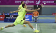 (140928) -- INCHEON, Sept. 28, 2014 () -- Zhang Nan (front) of China returns the shuttleco...