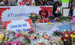 Flowers and messages at a memorial during an inter-faith vigil at Nathan Phillips Square i...