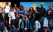 Michelle Obama dances on stage, joined by students, stars, performing artists and athletes...