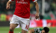 Benfica's Brazilian forward Jonas vies with Sporting's midfielder Rodrigo Battaglia from A...