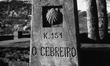 The milestone indicates the distance from Santiago, in Alto O' Cebreiro , Spain, on Decemb...