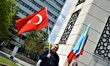 A man waving a Turkish flag poses for a photo during a mourning rally marking the Deportat...