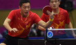 (141001) -- INCHEON, Oct. 1, 2014 () -- Xu Xin (L) and Fan Zhendong of China compete durin...