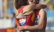 (141002) -- INCHEON, Oct. 2, 2014 () -- Wei Yongli (R) of China hugs her teammate Tao Yuji...