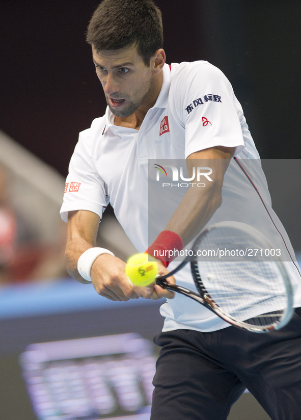 (141003) -- BEIJING, Oct. 3, 2014 () -- Novak Djokovic of Serbia returns a hit during the men's quarterfinal match against Grigor Dimitrov o...