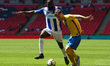 Kevin Hayes of Stockton Town under pressure from Baboucarr Jarra of Thatcham Townduring t...