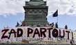 A giant banner reads "ZAD everwhere" as demonstrators take part in a "maree populaire" (wo...