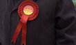 A person wearing a 'Vote Labour' roset on the day of the Heywood and Middleton by-election...