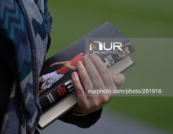 Fan is holding Roy Keane's new publication of his autobiography The Second Half at Aviva stadium, Dublin, Ireland. 9th October 2014, Photo:...