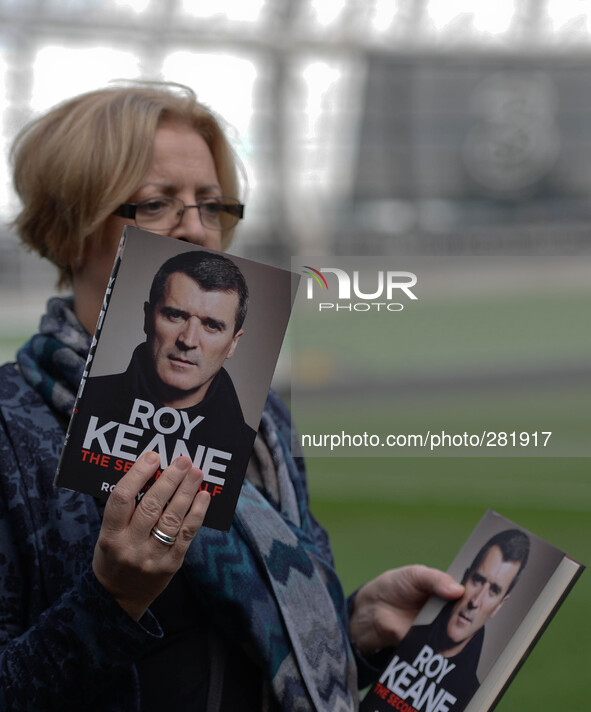 Fan is holding Roy Keane's new publication of his autobiography The Second Half at Aviva stadium, Dublin, Ireland. 9th October 2014, Photo:...