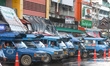 A view of blue local share taxi at the bus station in Chiang Rai awaiting for passengers....