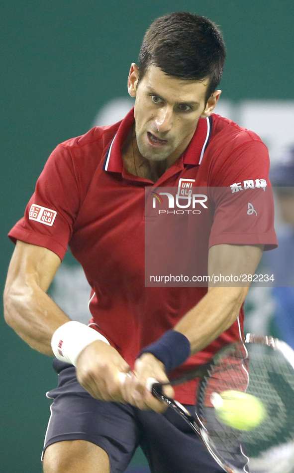 (141009) -- SHANGHAI, Oct. 9, 2014 () -- Serbia's Novak Djokovic returns the ball during the men's singles third round match against Kazakhs...