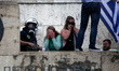 Protesters clash with riot police during a demonstration against the agreement between Gre...