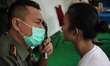 SEMARANG, INDONESIA - OCTOBER 14: Officer conduct a eye examination of a candidate's caree...