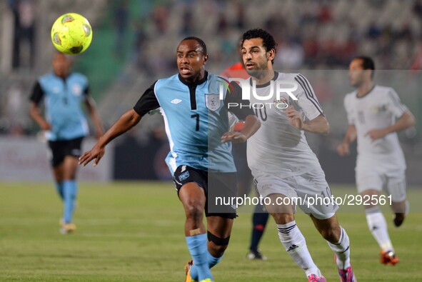 Egypt's Mohamed Salah, Right, and Botswana's Bonolo Phuduhudu compete for the ball during their African Cup of Nations group G qualifying so...