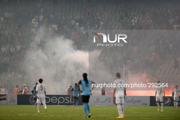 Egyptian fans light flares during the African Cup of Nations group G qualifying soccer match between Egypt and Botswana at Cairo Internation...