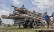 Kashmiri lumberjacks  load tree logs onto a logging truck at Timber Transport Range on Jul...