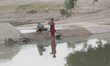 Afghan children washes clothes near a canal in Jalalabad Capital of nangarhar province on...
