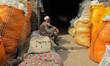 An Afghan labourer rest as he work at cotton factory in Jalalabad Capital of Nangarhar pro...