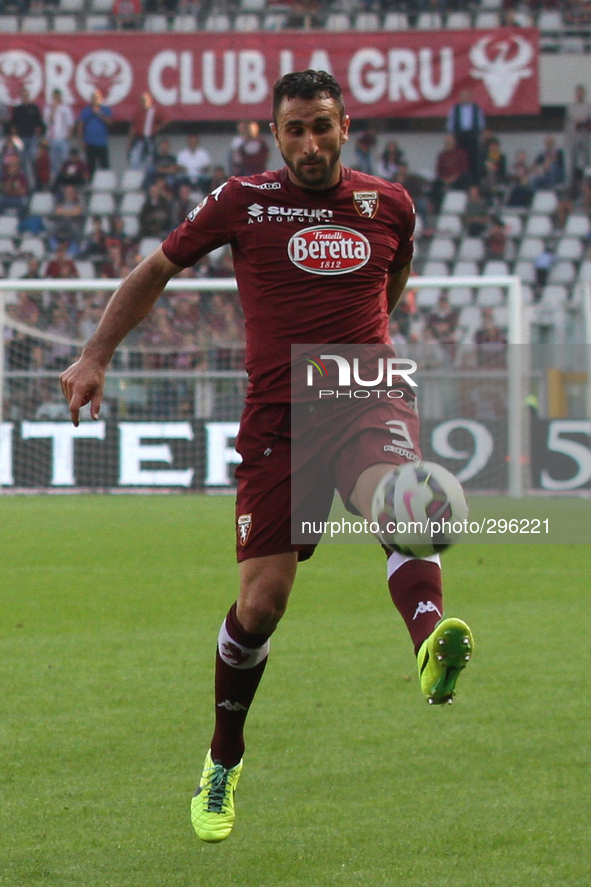 Torino defender Cristian Molinaro (3) reaches for the ball during the Serie A football match n.7 TORINO - UDINESE on 19/10/14 at the Stadio...