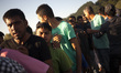 Immigrants stay in queue to fodd in Refugee camp in Velika Kladusa, Bosnia and Herzegovina...