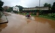 Rain logging waters submerge houses and vehicles as people comes out to safer place after...