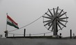 Steel spinning wheel with Indian Flag in the background can be seen at Connaught place, Ne...