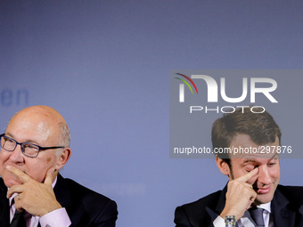 German Finance Minister Wolfgang Schauble, German Vice Chancellor and Economy Minister Sigmar Gabriel (unseen) French Finance Minister Micha...