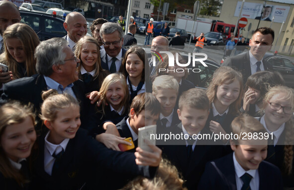Polish President, Bronisław Komorowski, takes a selfie with a group of young students as he leaves ICE Krakow Cenetr after meeting with 600...