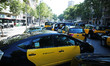 Taxi drivers block the street in Barcelona on July 30, 2018. - Taxi drivers across Spain j...