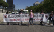 taxis block an avenue amid a strike by cabbies in Madrid on July 31, 2018. - Taxi drivers...