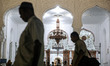 Muslims walks at the Baiturrahman Mosque in Banda Aceh, Indonesia on Monday, July 30, 2018...