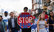 Demonstrators march down Clark Street towards Wrigley Field in a protest against gun viole...