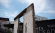 A remain of the Berlin Wall is pictured near the Checkpoint Charlie, Berlin on August 2, 2...
