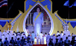 Thailand Prime Minister Prayuth Chan-ocha joins other well-wishers holding candles to cele...