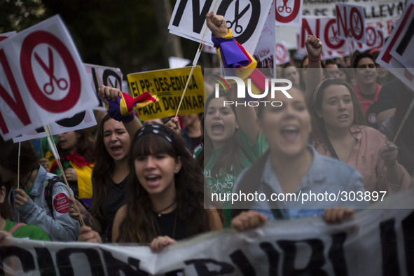 Students shout slogans during a protest against the government education reform and cutbacks in grants and staffing in Madrid, Spain, Thursd...