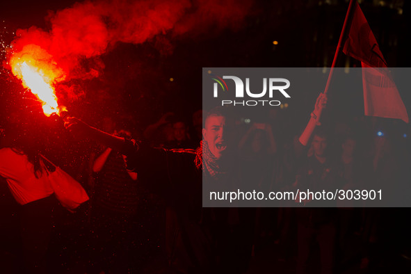 A student lights a flare during a protest against the government education reform and cutbacks in grants and staffing in Madrid, Spain, Thur...