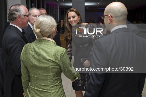 Britain's Catherine, Duchess of Cambridge (C), greets supporters as she attends an Autumn Gala evening in support of Action on Addiction, in...