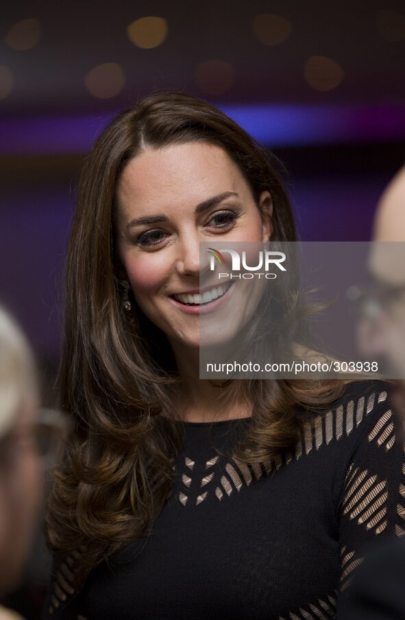 Britain's Catherine, Duchess of Cambridge (C), greets supporters as she attends an Autumn Gala evening in support of Action on Addiction, in...
