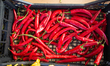 A carton with red chillis. Like every year the 'Ue Sbarassue' was held in the center of Ch...